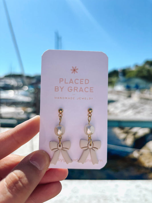 Cream Bow Pearl Earrings. bows, coquette, minimalist jewelry