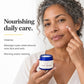 Woman applying Rose Face Cream to her cheek, showing how to use it by The Yellow Bird